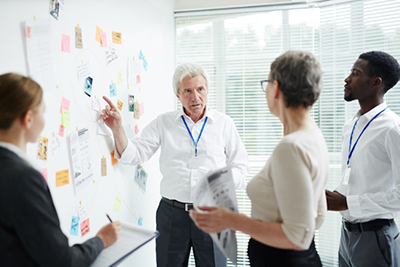 Researchers discussing clinical trial ethics for rare diseases