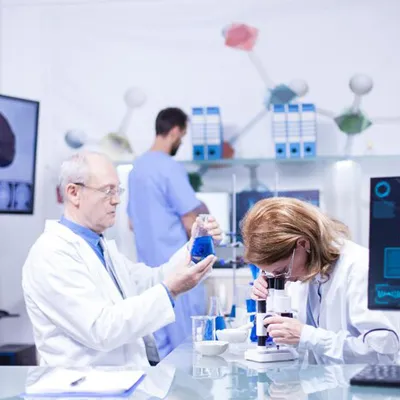 Lab technician analyzing digital health data for drug development
