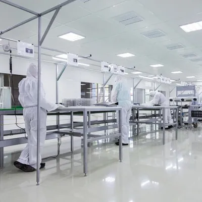 Laboratory technician using rapid microbiological testing device