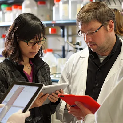 Team of researchers and clinicians discussing post-trial communication strategies