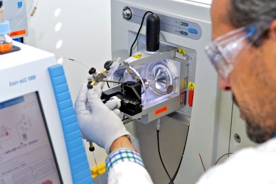 Laboratory bench with mass spectrometer and computer workstation