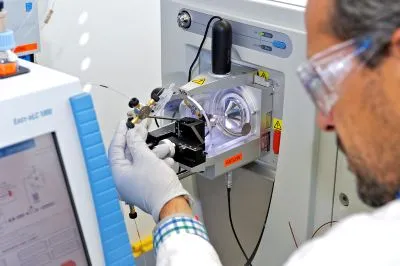 Laboratory bench with mass spectrometer and computer workstation