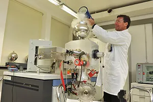 Scientists using mass spectrometry in a laboratory setting